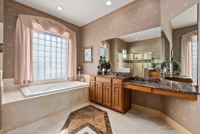 bathroom featuring wallpapered walls, plenty of natural light, a shower stall, and a bath