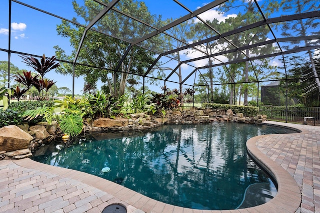 outdoor pool with a patio and a lanai