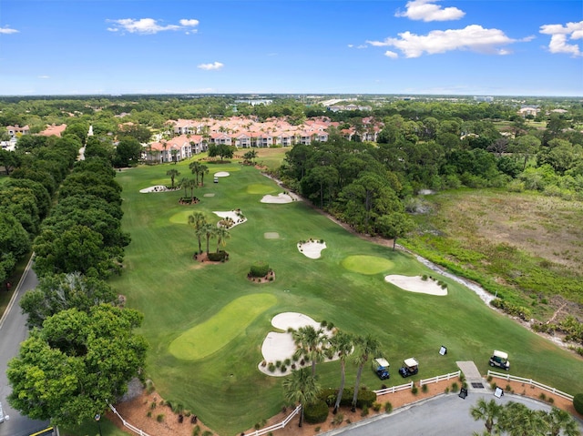 birds eye view of property with golf course view