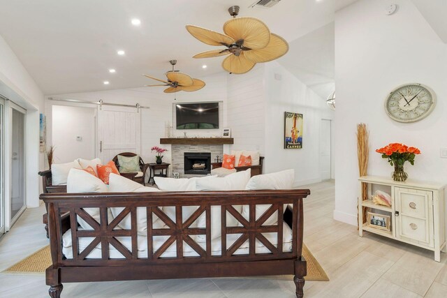1155 Rainwood Cir, Palm Beach Gardens, FL 33410 - living area with ceiling fan, a fireplace, vaulted ceiling, a barn door, and recessed lighting
