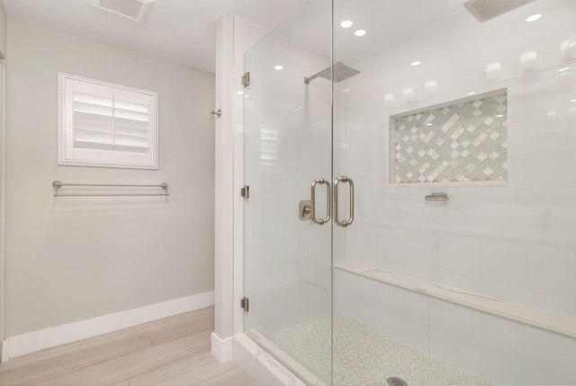 1155 Rainwood Cir, Palm Beach Gardens, FL 33410 - bathroom featuring recessed lighting, baseboards, wood finished floors, and a stall shower