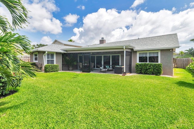 1155 Rainwood Cir, Palm Beach Gardens, FL 33410 - back of property featuring a yard, fence, a sunroom, and stucco siding