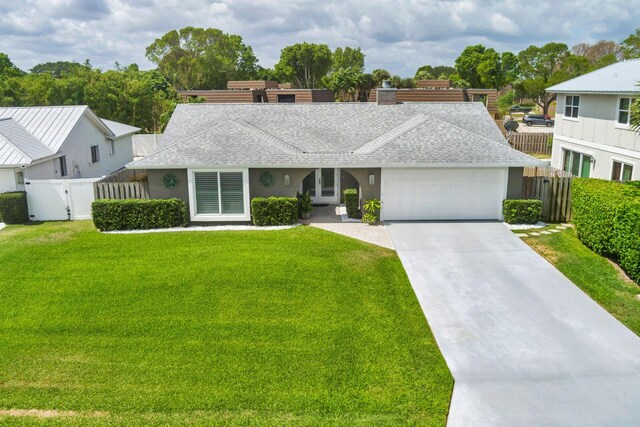1155 Rainwood Cir, Palm Beach Gardens, FL 33410 - ranch-style home with roof with shingles, fence, an attached garage, a front lawn, and a gate