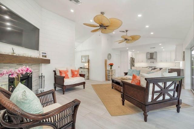 1155 Rainwood Cir, Palm Beach Gardens, FL 33410 - living room featuring a ceiling fan, visible vents, a fireplace, lofted ceiling, and recessed lighting