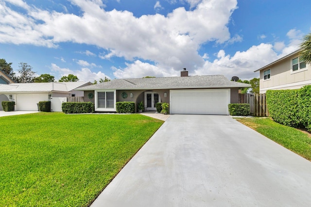 1155 Rainwood Cir, Palm Beach Gardens, FL 33410 - ranch-style house with driveway, a front yard, fence, an attached garage, and stucco siding