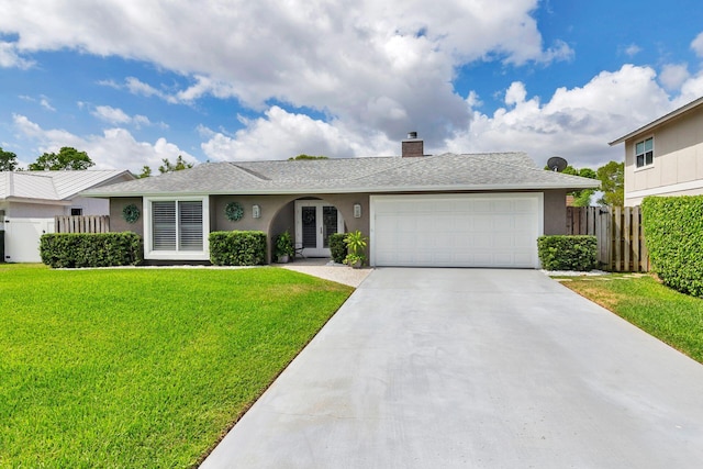 1155 Rainwood Cir, Palm Beach Gardens, FL 33410 - single story home featuring an attached garage, a front lawn, stucco siding, and fence