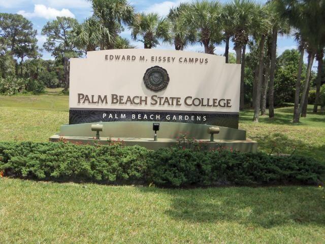 1155 Rainwood Cir, Palm Beach Gardens, FL 33410 - community / neighborhood sign featuring a lawn