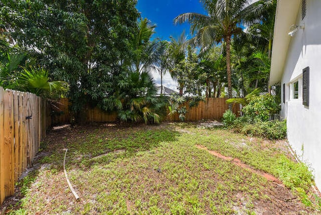 view of yard with a fenced backyard