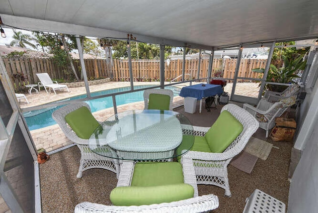 view of swimming pool featuring a fenced in pool, outdoor dining space, a patio, and a fenced backyard