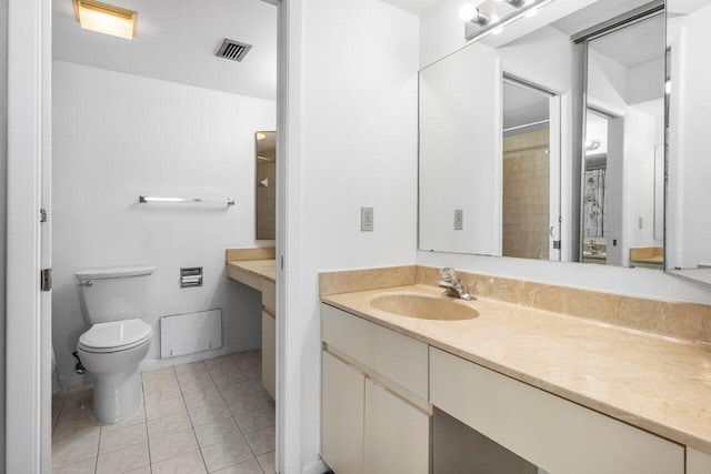 bathroom featuring toilet, visible vents, tile patterned flooring, and vanity