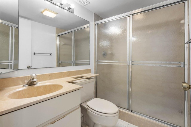 full bath with visible vents, a stall shower, vanity, tile patterned floors, and toilet