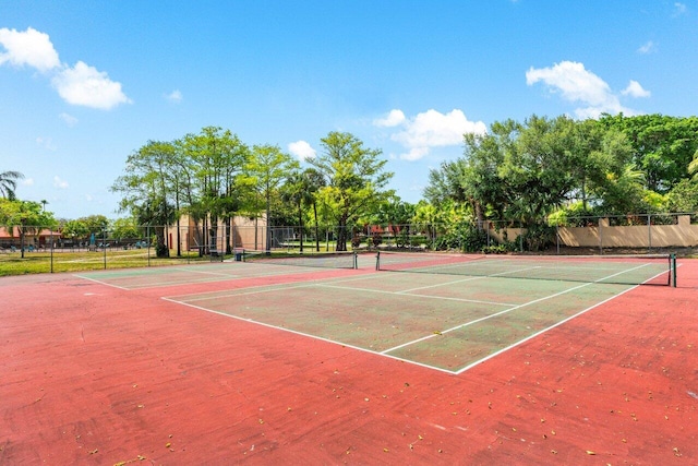 view of sport court featuring fence