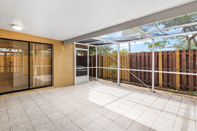 unfurnished sunroom featuring a healthy amount of sunlight