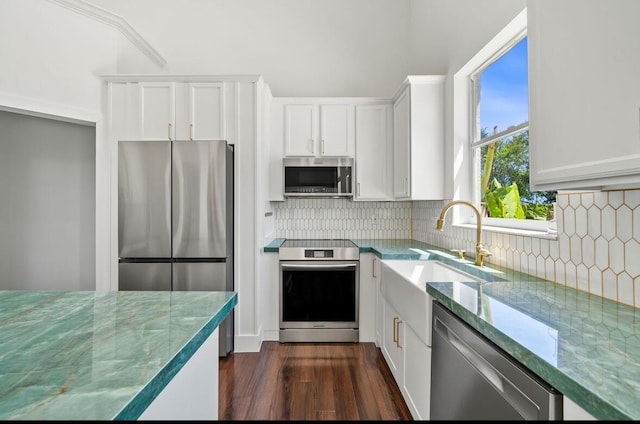 3950 Fieldview Way, Wellington, FL 33414 - kitchen featuring white cabinetry, a sink, appliances with stainless steel finishes, stone countertops, and dark wood-style flooring