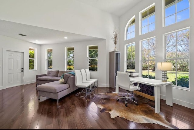 3950 Fieldview Way, Wellington, FL 33414 - office area featuring wood finished floors, visible vents, a towering ceiling, and baseboards