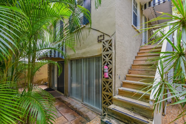 126 Peruvian Ave, Palm Beach, FL 33480 - doorway to property with stucco siding