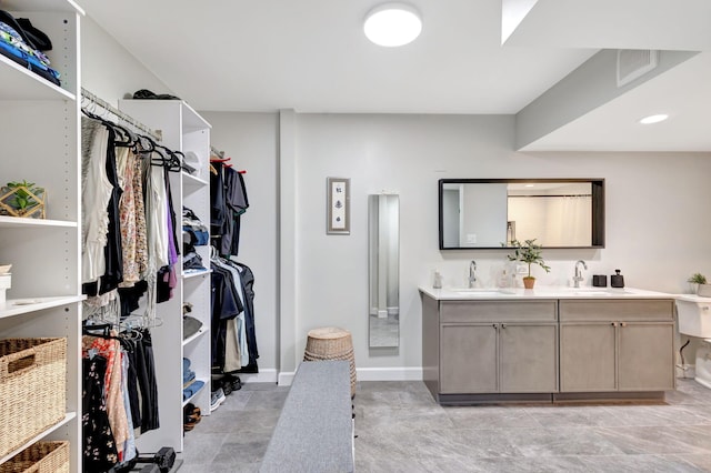 spacious closet featuring a sink