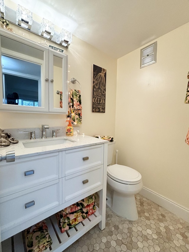82 Camden Unit D, West Palm Beach, FL 33417 - bathroom with vanity, toilet, and baseboards