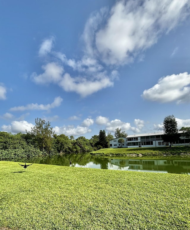 82 Camden Unit D, West Palm Beach, FL 33417 - view of grassy yard with a water view