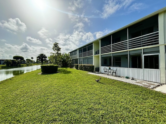 82 Camden Unit D, West Palm Beach, FL 33417 - view of green lawn featuring a water view