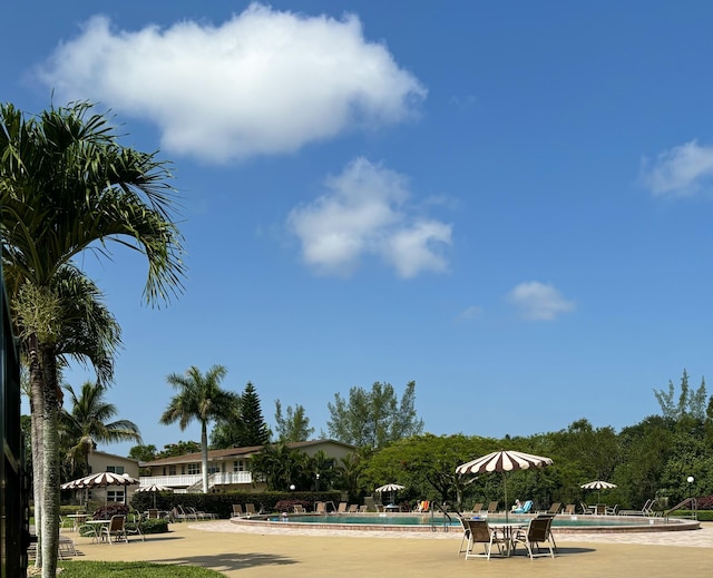 82 Camden Unit D, West Palm Beach, FL 33417 - view of property's community featuring a pool and a patio