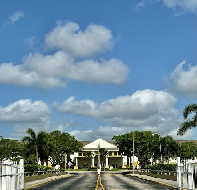 82 Camden Unit D, West Palm Beach, FL 33417 - view of asphalt street with traffic signs, curbs, and street lighting