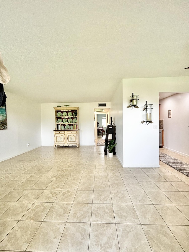 82 Camden Unit D, West Palm Beach, FL 33417 - empty room featuring light tile patterned floors and a textured ceiling
