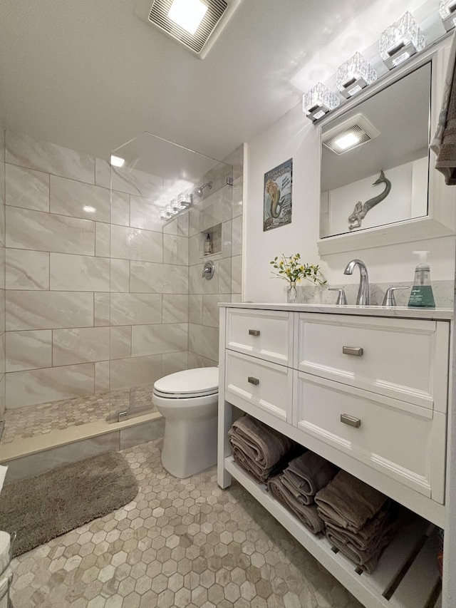82 Camden Unit D, West Palm Beach, FL 33417 - full bathroom featuring a tile shower, vanity, and toilet
