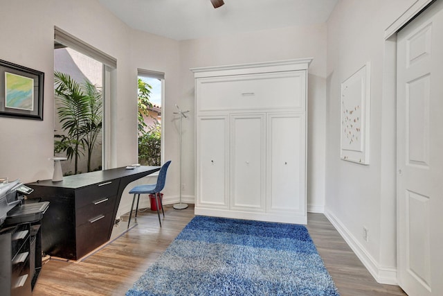 2530 NW 52nd St, Boca Raton, FL 33496 - office area with light wood finished floors, baseboards, and ceiling fan