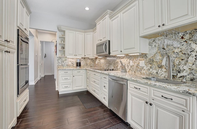 2530 NW 52nd St, Boca Raton, FL 33496 - kitchen with appliances with stainless steel finishes, a sink, open shelves, dark wood-style flooring, and decorative backsplash