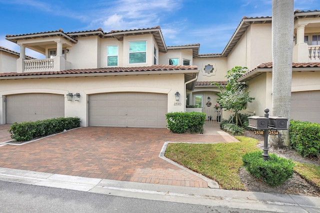 2530 NW 52nd St, Boca Raton, FL 33496 - mediterranean / spanish-style home with a tile roof, a garage, stucco siding, and decorative driveway