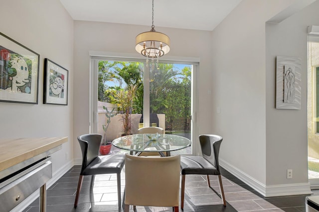 2530 NW 52nd St, Boca Raton, FL 33496 - dining space with a chandelier and baseboards