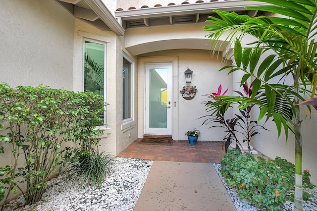 2530 NW 52nd St, Boca Raton, FL 33496 - doorway to property with stucco siding