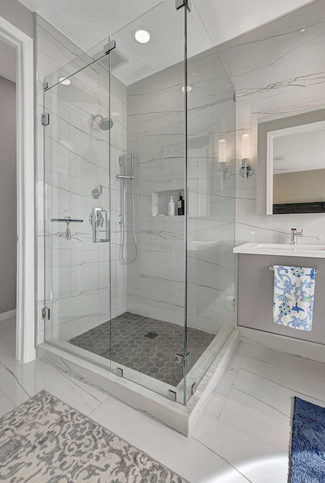 2530 NW 52nd St, Boca Raton, FL 33496 - full bathroom featuring marble look tiles, a marble finish shower, recessed lighting, and vanity