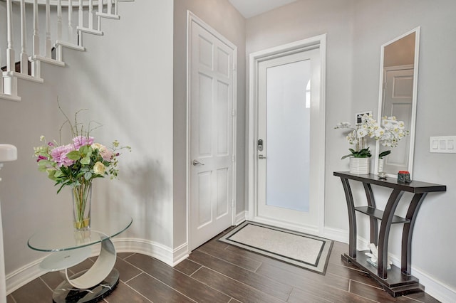 2530 NW 52nd St, Boca Raton, FL 33496 - foyer with baseboards and dark wood-style flooring
