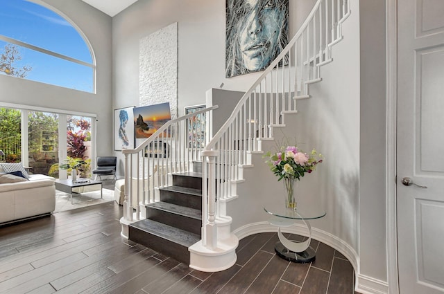 2530 NW 52nd St, Boca Raton, FL 33496 - staircase with wood finished floors and a high ceiling