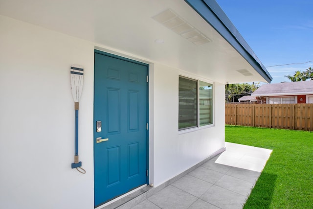 property entrance featuring stucco siding
