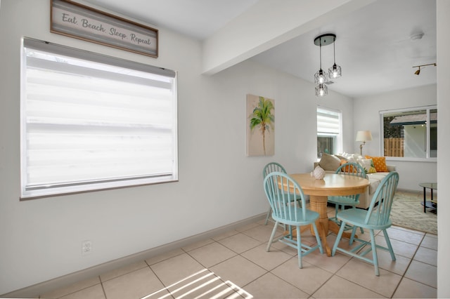 dining space with tile patterned flooring and baseboards
