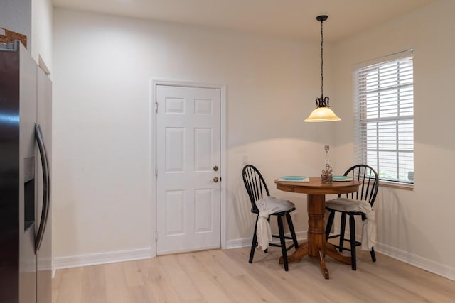 4891 Bonsai Cir Unit 105, Palm Beach Gardens, FL 33418 - dining space with baseboards and wood finished floors
