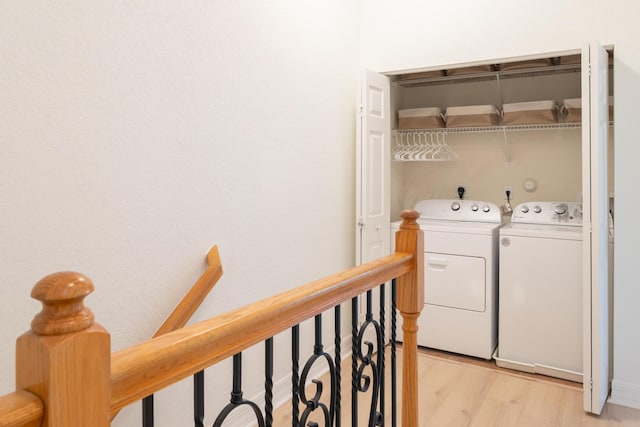 4891 Bonsai Cir Unit 105, Palm Beach Gardens, FL 33418 - clothes washing area featuring light wood-style floors, laundry area, and washer and clothes dryer