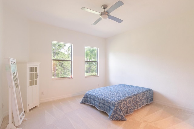 4891 Bonsai Cir Unit 105, Palm Beach Gardens, FL 33418 - bedroom with a ceiling fan, baseboards, and light carpet