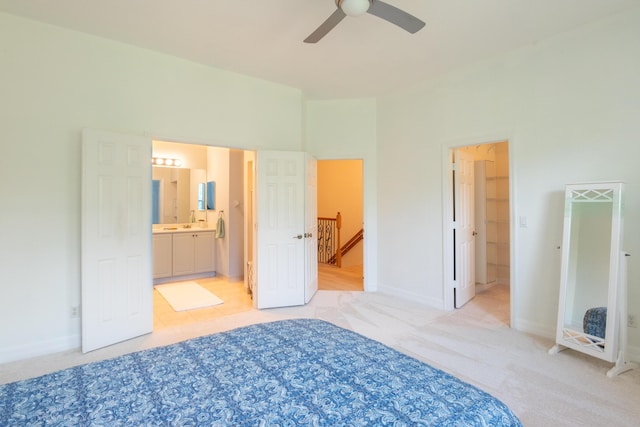 4891 Bonsai Cir Unit 105, Palm Beach Gardens, FL 33418 - unfurnished bedroom with light colored carpet, a sink, baseboards, and ensuite bath