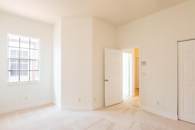 4891 Bonsai Cir Unit 105, Palm Beach Gardens, FL 33418 - spare room with baseboards and light carpet