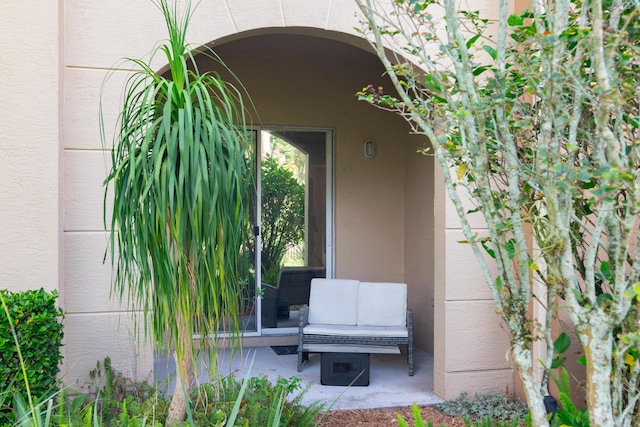 4891 Bonsai Cir Unit 105, Palm Beach Gardens, FL 33418 - view of exterior entry featuring stucco siding