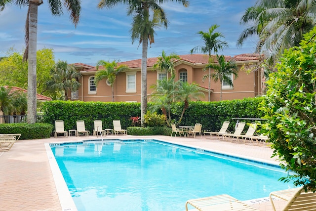 4891 Bonsai Cir Unit 105, Palm Beach Gardens, FL 33418 - pool featuring a patio and fence