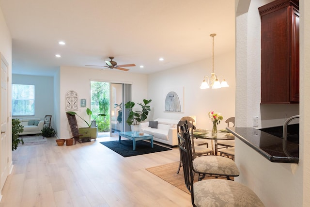 4891 Bonsai Cir Unit 105, Palm Beach Gardens, FL 33418 - interior space with light wood-type flooring, recessed lighting, plenty of natural light, and ceiling fan with notable chandelier