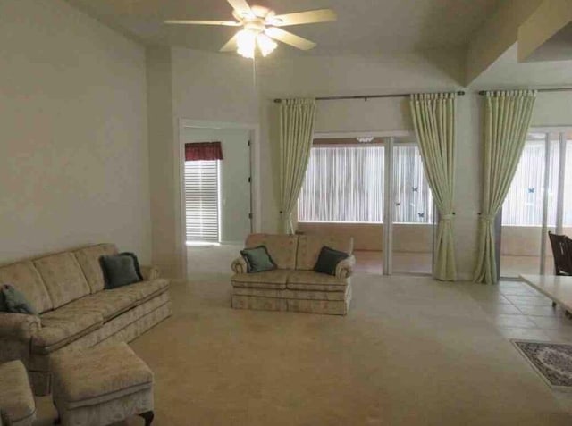 3531 Plume Way SE, Palm Bay, FL 32909 - carpeted living room featuring a healthy amount of sunlight and a ceiling fan