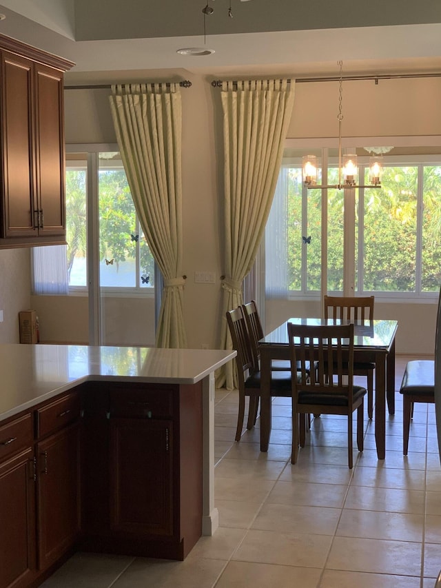 3531 Plume Way SE, Palm Bay, FL 32909 - dining space featuring light tile patterned floors and a chandelier
