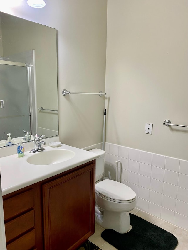 3531 Plume Way SE, Palm Bay, FL 32909 - bathroom featuring vanity, tile patterned floors, a shower stall, and toilet