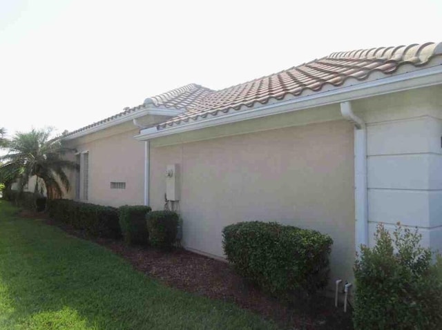 3531 Plume Way SE, Palm Bay, FL 32909 - view of side of property featuring stucco siding and a tile roof